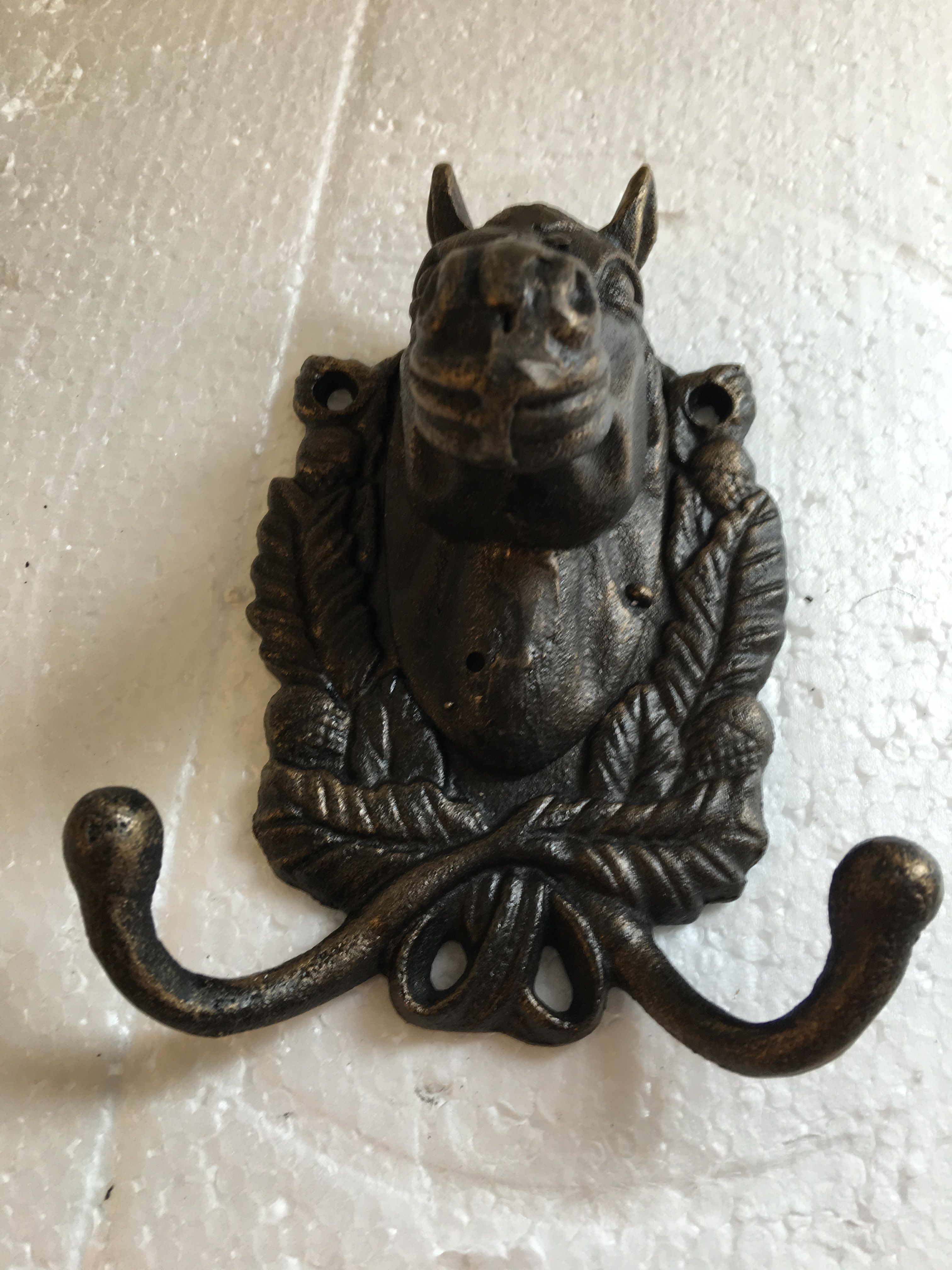 Cast iron-bronze colored horse head with double coat hook
