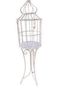 Large birdcage standing on graceful wrought iron legs, a piece of jewelry!!