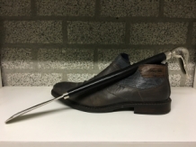 Beautiful nickel hardwood shoehorn with duck head nickel.