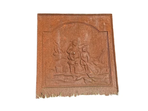 Antique hearth plate with old scene, vintage cast iron, rustic