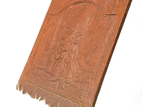 Antique hearth plate with old scene, vintage cast iron, rustic