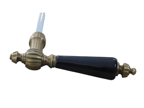 1 Door handle with ceramic handle black, brass patinated