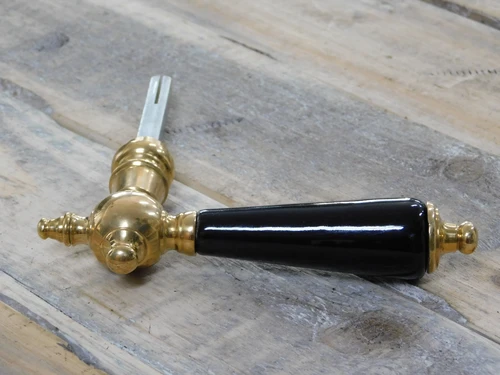 1 door handle with porcelain handle in black, polished brass with mandrel
