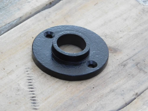 Door handle rosette made of iron, black.