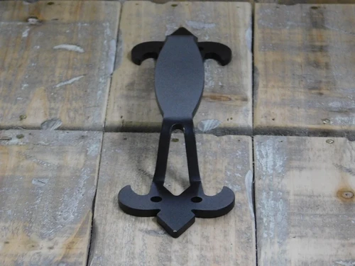 Large, high-quality wrought iron door handle with a medieval look
