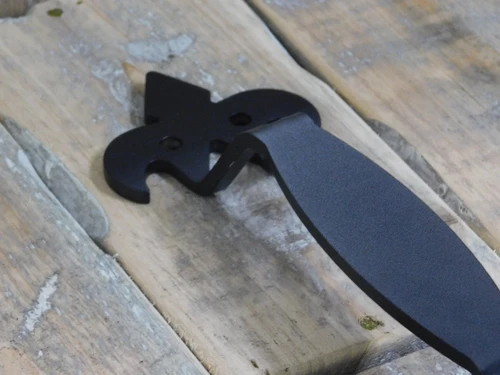 Large, high-quality wrought iron door handle with a medieval look