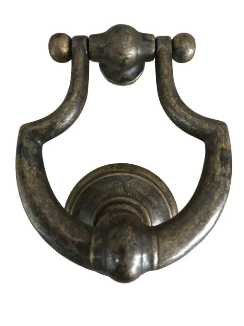 Door knocker, stylish and antique dark brass.