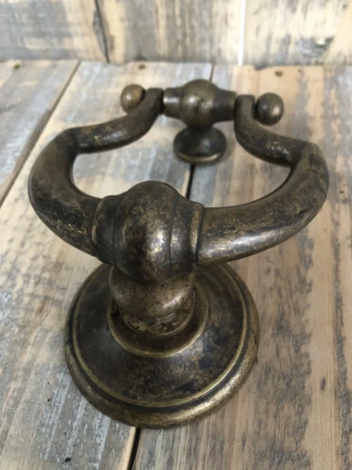 Door knocker, stylish and antique dark brass.