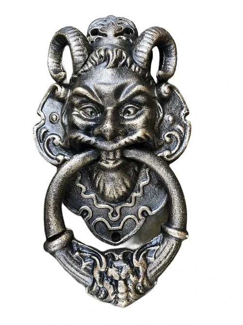 Cast iron bronze door knocker with devil's head.