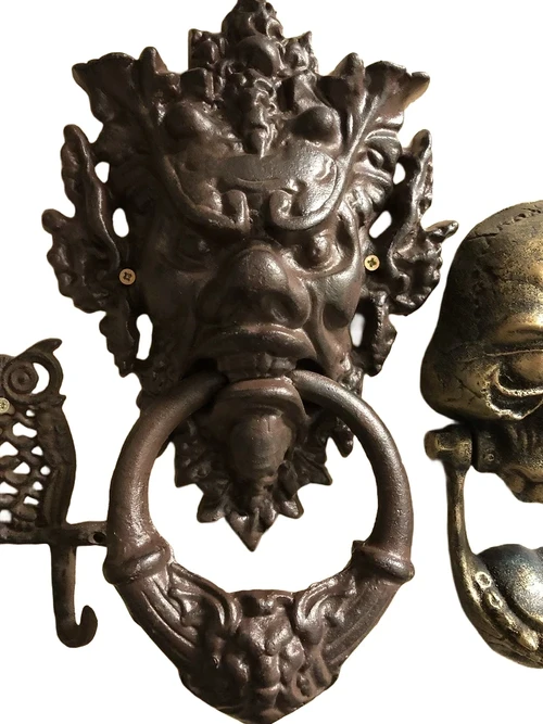 Cast iron door knocker with devil's head-dark brown, very distinctive!