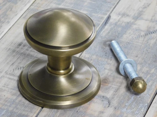 Fixed door knob - patinated brass - including rosette