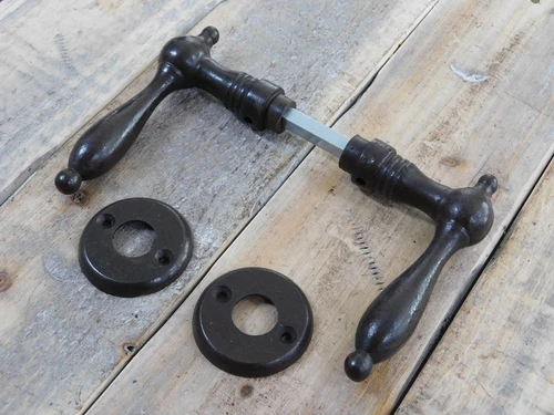 Door hardware set, 2 door handles, 2 rosettes and a mandrel, dark brown