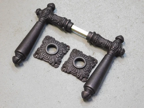 Set of door handles - including rosettes - iron - red/brown rusted