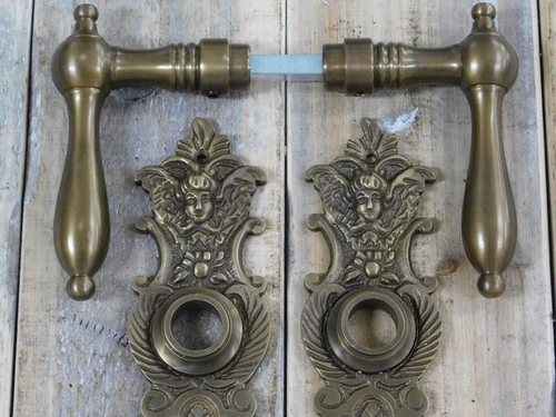 Set deurbeslag: 2 klinken + 2 deurplaten Engelen, messing