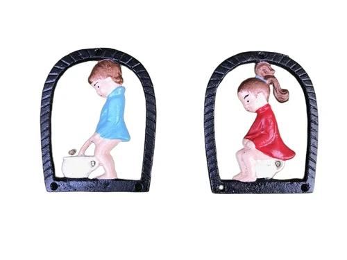 Set of toilet signs of a boy and a girl, metal in color