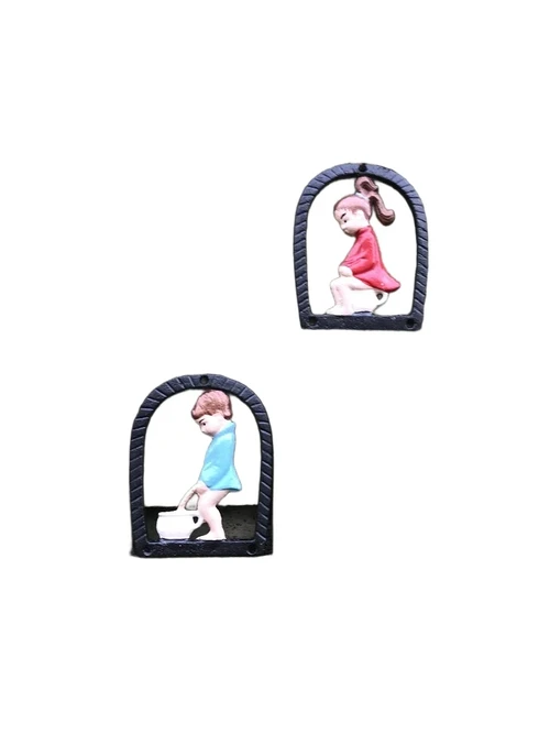 Set of toilet signs of a boy and a girl, metal in color