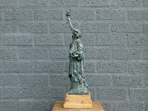 A bronze statue/sculpture of ''THE STATUE OF LIBERTY''