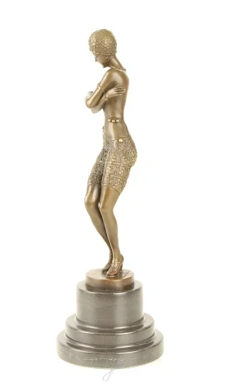 A bronze statue/sculpture of a coy dancer