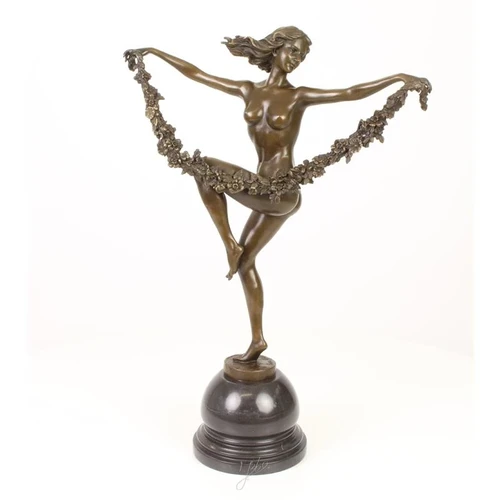 A bronze statue/sculpture of a flower dancer