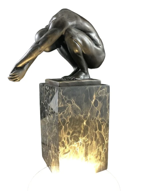 A bronze statue/sculpture of a diving man, ''THE DIVE''