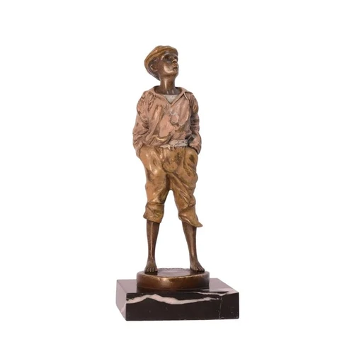 A bronze statue/sculpture of a whistling boy