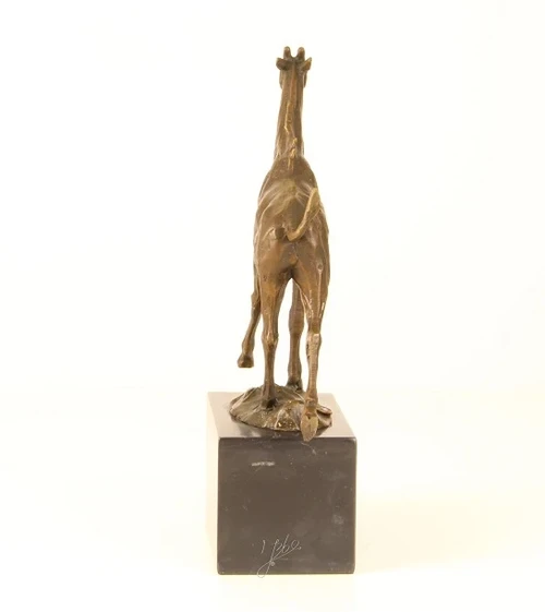 A bronze statue/sculpture of a giraffe