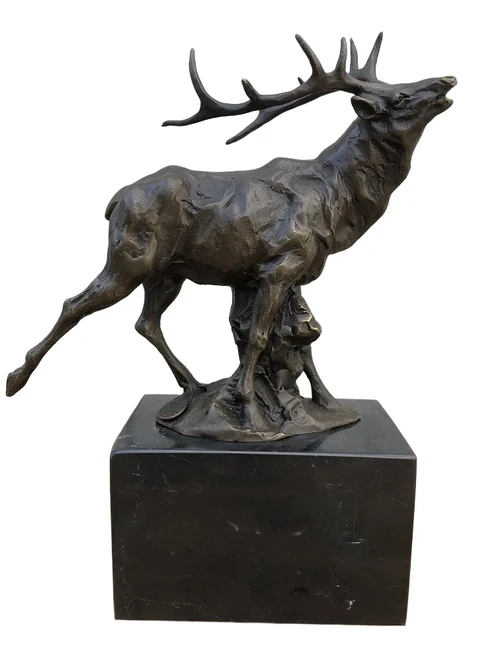 A bronze statue/sculpture of a deer