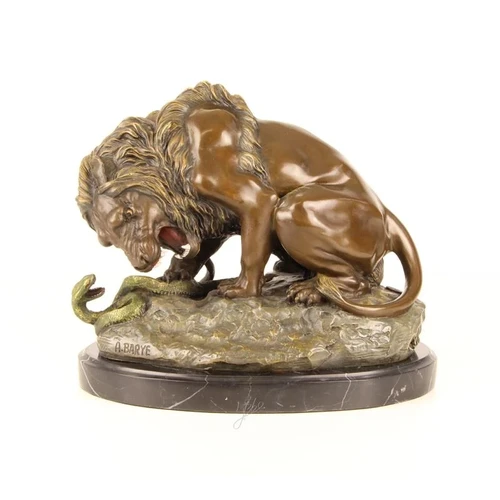 A bronze statue/sculpture of a lion and a snake