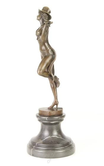 A bronze statue/sculpture of a theater dancer