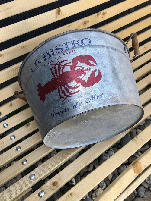 A very decorative, beautiful zinc bowl small with the text 