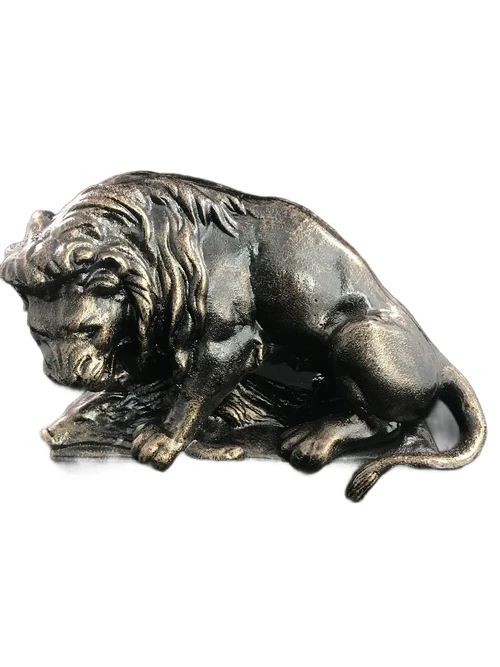 A beautiful statue of a lion with its prey, a boar, made of cast iron, bronze look!