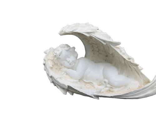 Statue of an angel sleeping in his wings, made of polystone