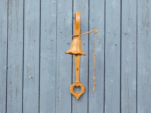 Cast iron wall bell - with wreath - rust colour - retro design