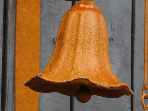 Cast iron wall bell - with wreath - rust colour - retro design