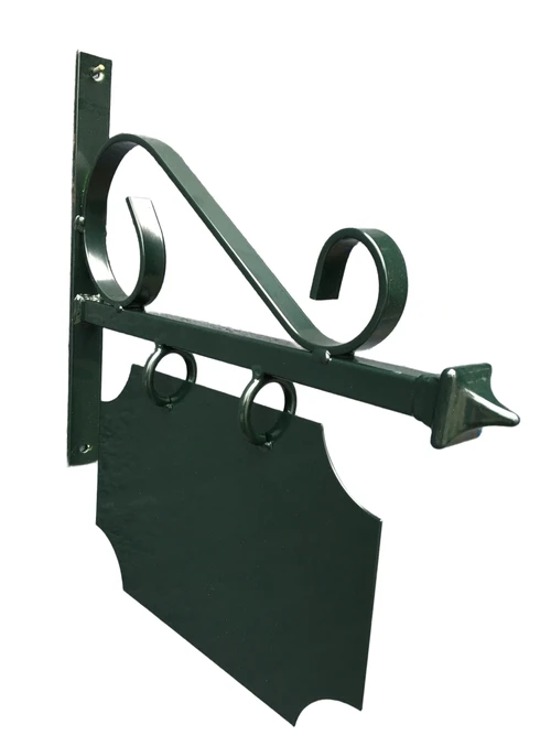 Store nameplate for old downtown, advertising sign made of metal, painted green.