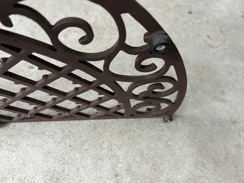 Cast iron doormat, half round.
