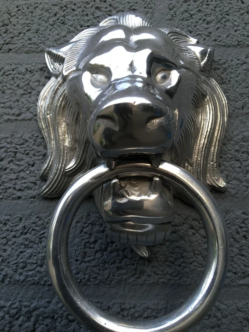 Beautiful aluminum impression of a full lion's head with ring, door knocker.