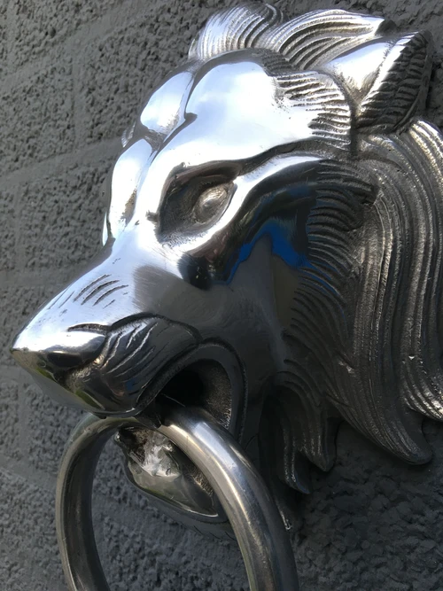 Beautiful aluminum impression of a full lion's head with ring, door knocker.