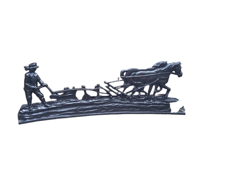 Wall decoration , cast iron black fireplace plate farmer with horse and plow.