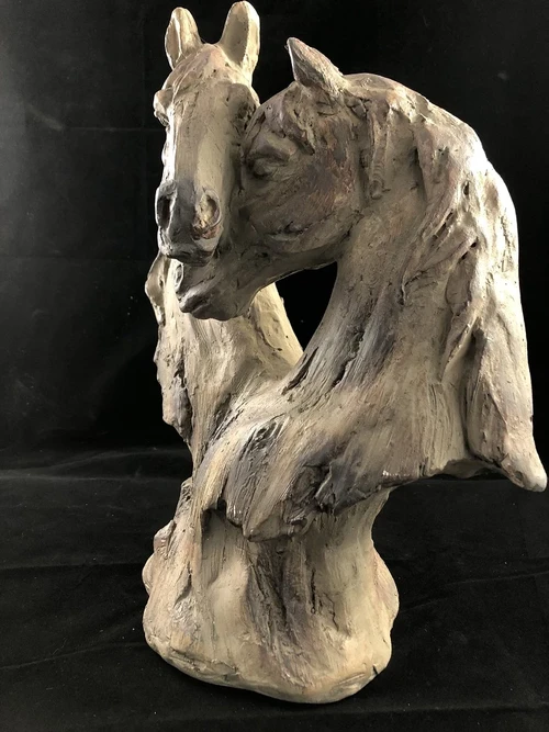 Beautiful horse statue of two horse heads, wood look.