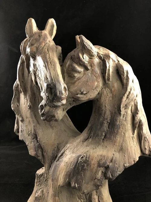 Beautiful horse statue of two horse heads, wood look.