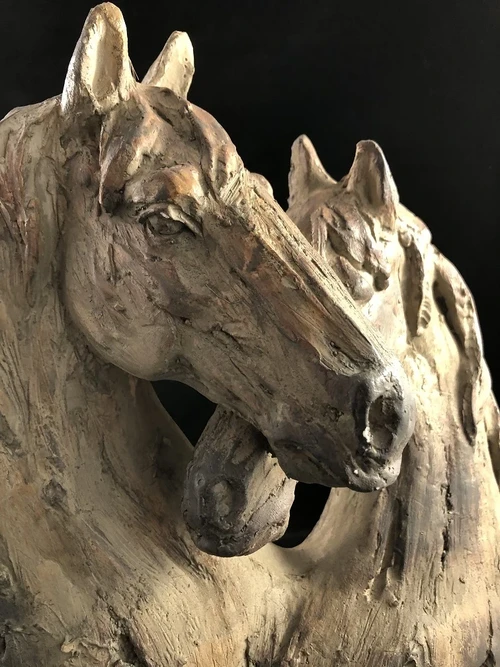 Beautiful horse statue of two horse heads, wood look.