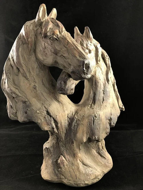 Beautiful horse statue of two horse heads, wood look.