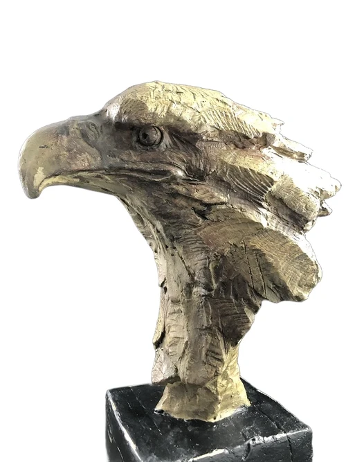 A beautiful head of an eagle, beautiful in detail, polystone wood look