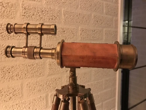 Beautiful decorative telescope on a wooden tripod
