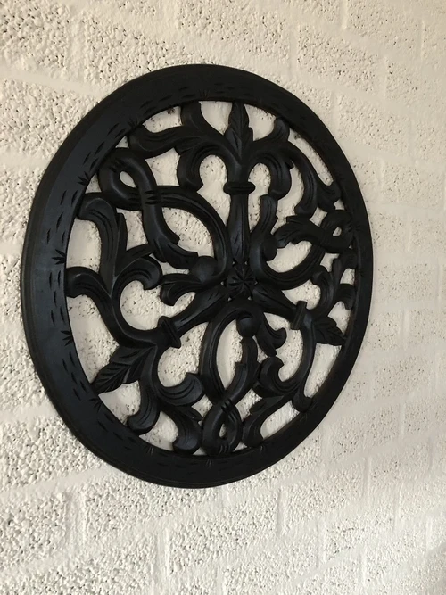 Wall ornament round, beautifully carved, black-brown, small