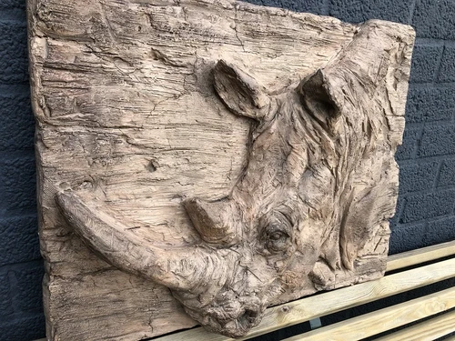 Wall ornament wood look with 3D image of a rhino, polystone-wood.