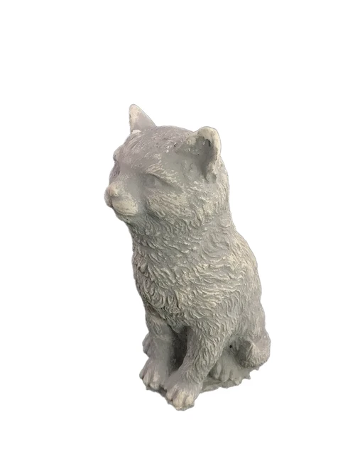 A beautiful sitting cat, made of stone, beautiful in detail