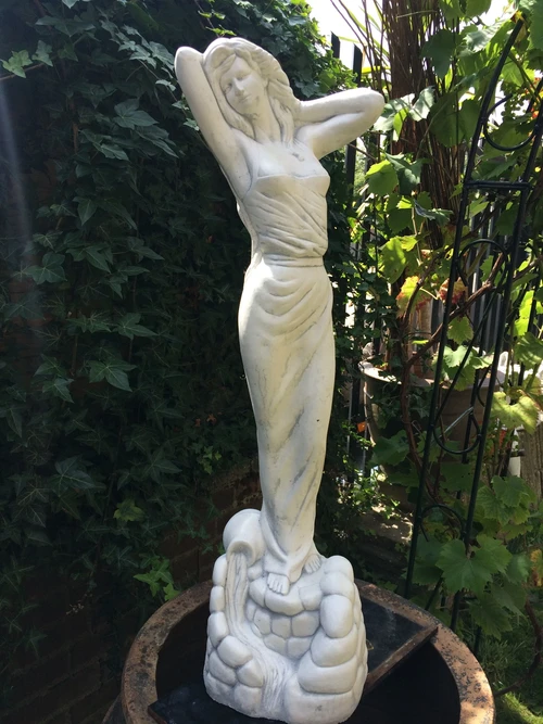 Beautiful statue of a lady, full of stone