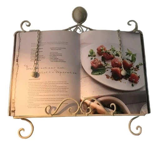 A white stand / holder for pieces of music, menus and, for example, books